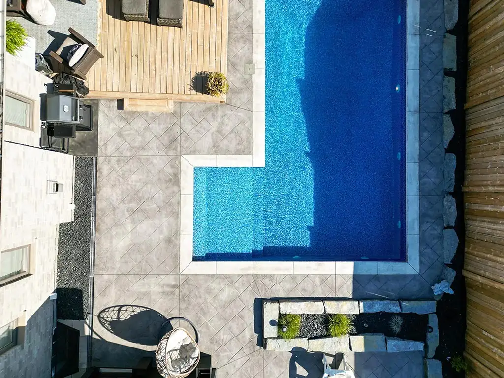 Custom concrete patio design with pool