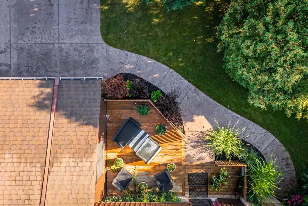 Concrete walkway that leads into a deck