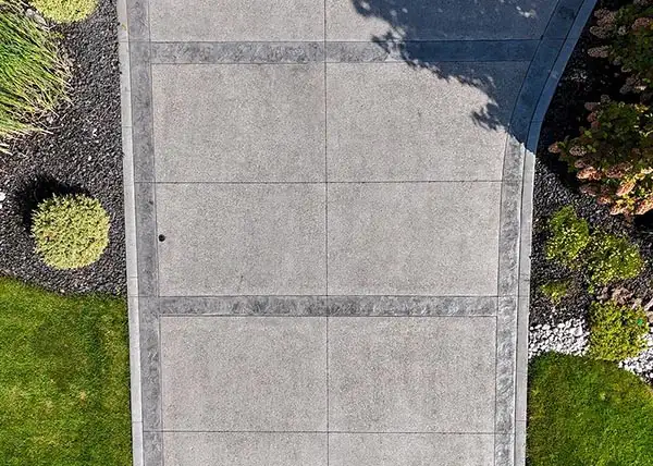 Custom concrete driveway installed by AKKO Ltd